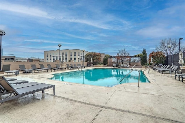 view of swimming pool with a patio area