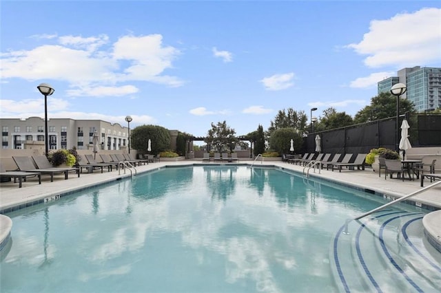 view of swimming pool featuring a patio area