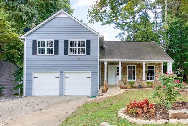 view of front facade featuring a front lawn and a garage