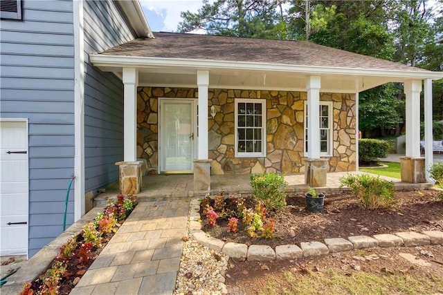 doorway to property featuring a porch