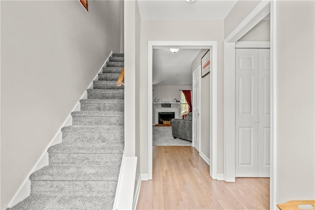 staircase featuring hardwood / wood-style flooring