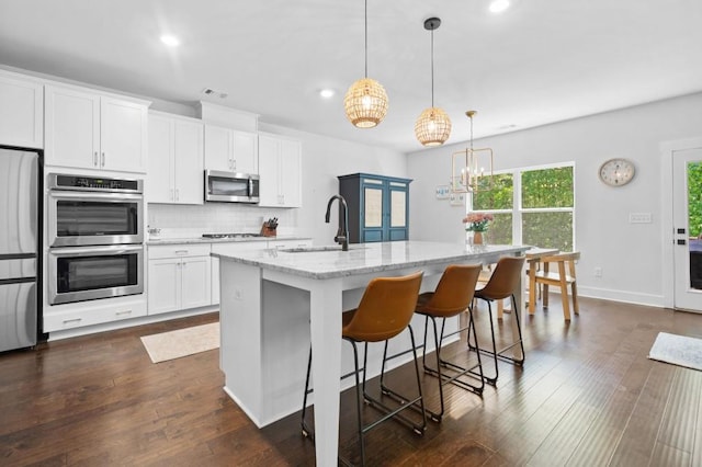178 Crestbrook Way, Dallas, GA 30157 - kitchen featuring stainless steel appliances, a sink, recessed lighting, light stone countertops, and tasteful backsplash