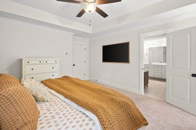 178 Crestbrook Way, Dallas, GA 30157 - bedroom featuring light carpet, a tray ceiling, ensuite bath, a ceiling fan, and baseboards