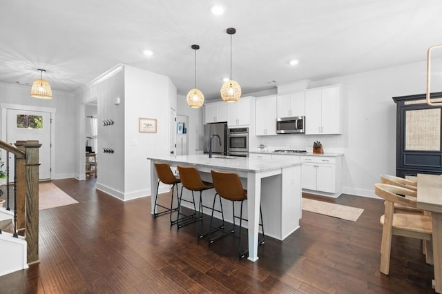 178 Crestbrook Way, Dallas, GA 30157 - kitchen featuring appliances with stainless steel finishes, an island with sink, white cabinets, decorative backsplash, and recessed lighting