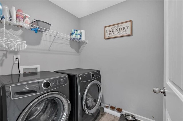 laundry area featuring washing machine and dryer