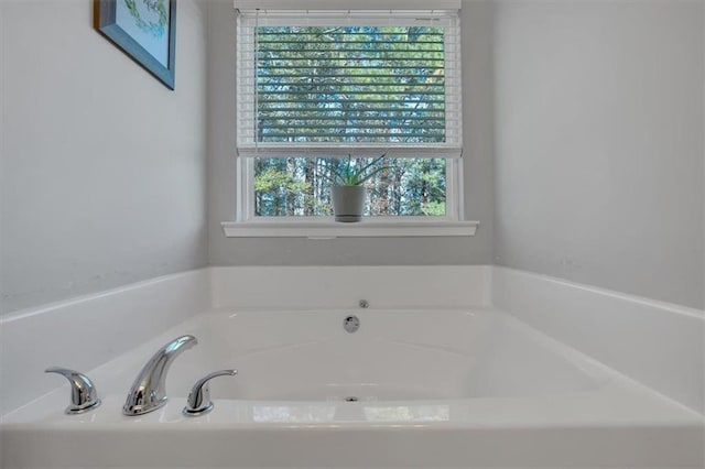 bathroom featuring a tub to relax in