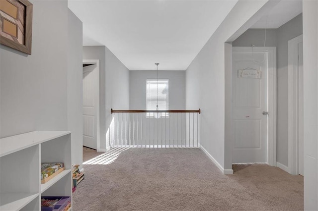 corridor with carpet flooring