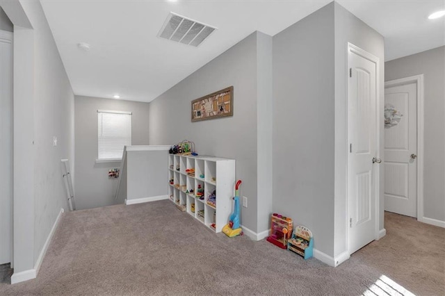 game room with light carpet