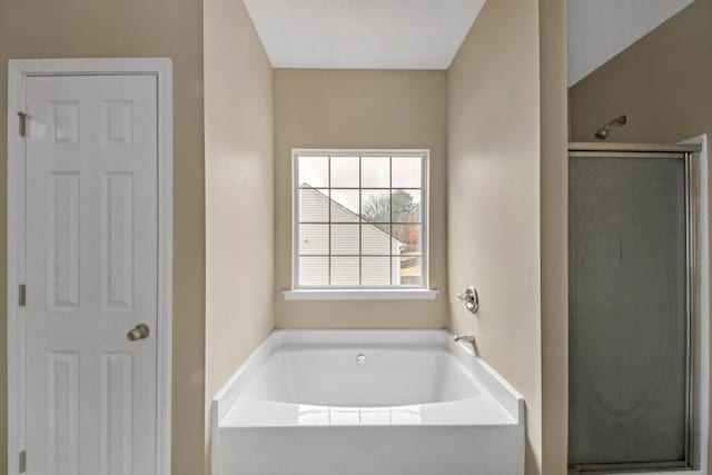 bathroom with shower with separate bathtub