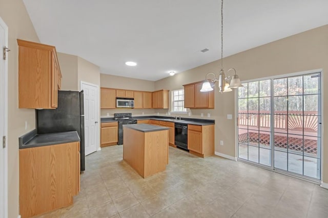 kitchen with sink, a notable chandelier, black appliances, a kitchen island, and decorative light fixtures