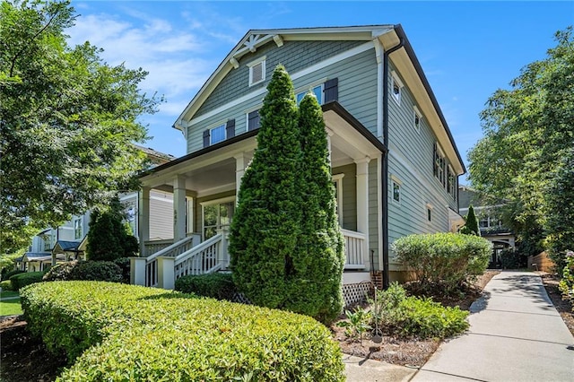 view of property exterior with covered porch