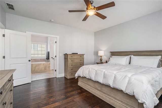 bedroom featuring ensuite bath, ceiling fan, and dark hardwood / wood-style floors