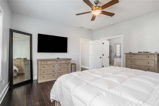 bedroom featuring connected bathroom, ceiling fan, and dark hardwood / wood-style flooring