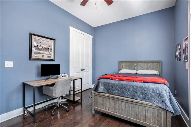 bedroom featuring dark hardwood / wood-style flooring, ceiling fan, and a closet