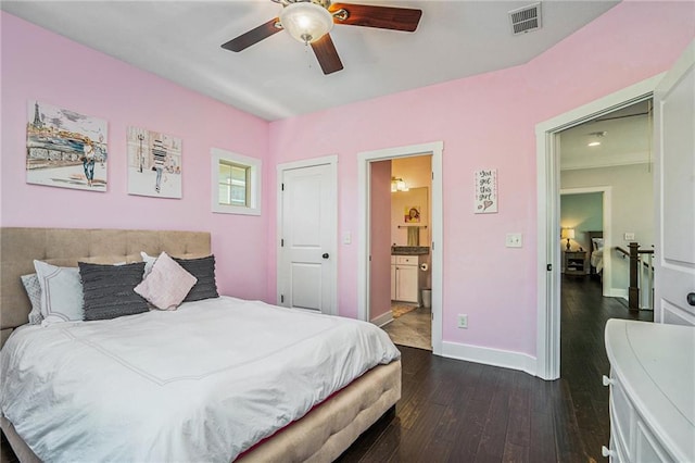 bedroom featuring ceiling fan, connected bathroom, and dark wood-type flooring