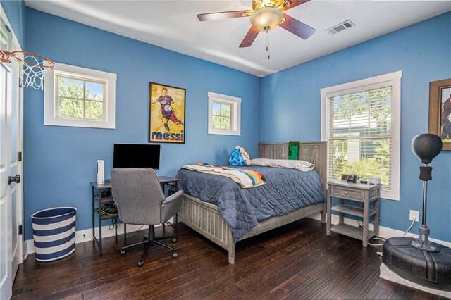 bedroom featuring ceiling fan and dark hardwood / wood-style floors