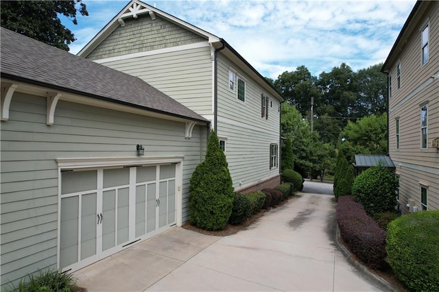 view of property exterior featuring a garage