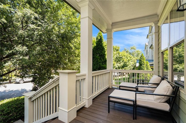 wooden terrace featuring covered porch