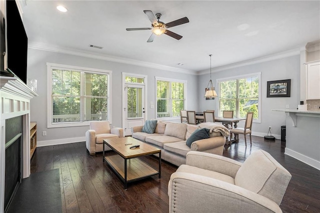 living room featuring ornamental molding, ceiling fan, and dark hardwood / wood-style floors