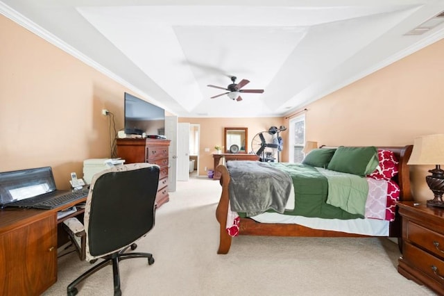 bedroom featuring ceiling fan, crown molding, light colored carpet, and a tray ceiling