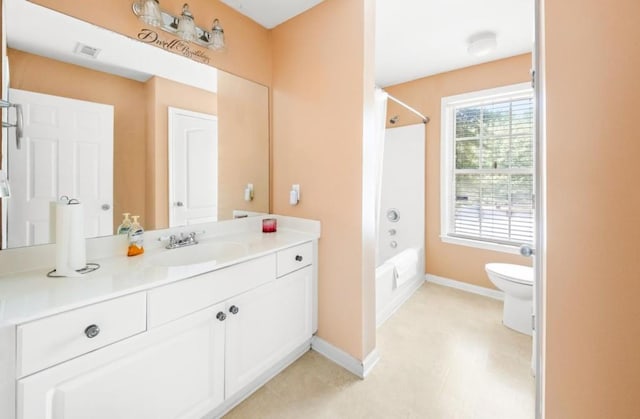 bathroom with visible vents, toilet, vanity,  shower combination, and baseboards