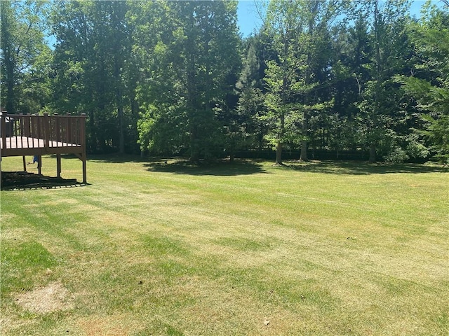 1173 Jimson Cir SE, Conyers, GA 30013 - view of grassy yard featuring a deck