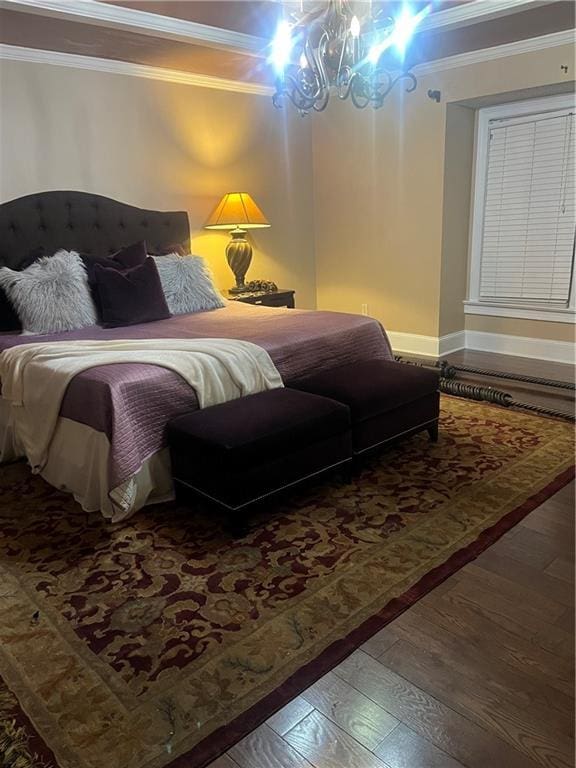 1173 Jimson Cir SE, Conyers, GA 30013 - bedroom featuring ornamental molding, hardwood / wood-style floors, a chandelier, and baseboards