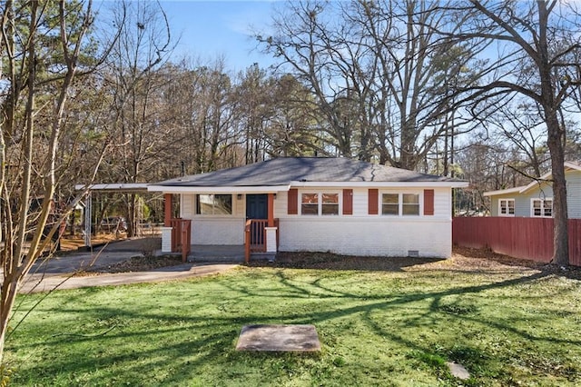 view of front facade with brick siding, crawl space, fence, a carport, and a front lawn