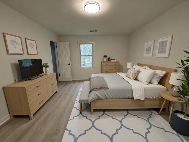 bedroom featuring light hardwood / wood-style flooring