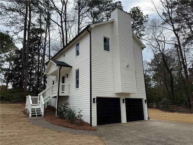 view of side of home featuring a garage