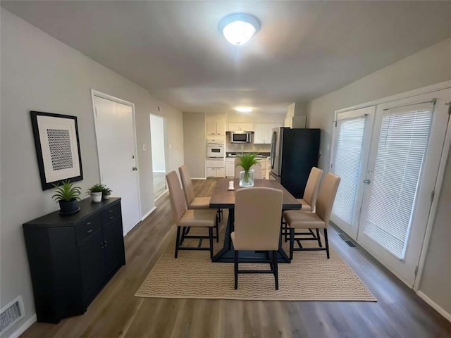 dining room featuring dark hardwood / wood-style floors