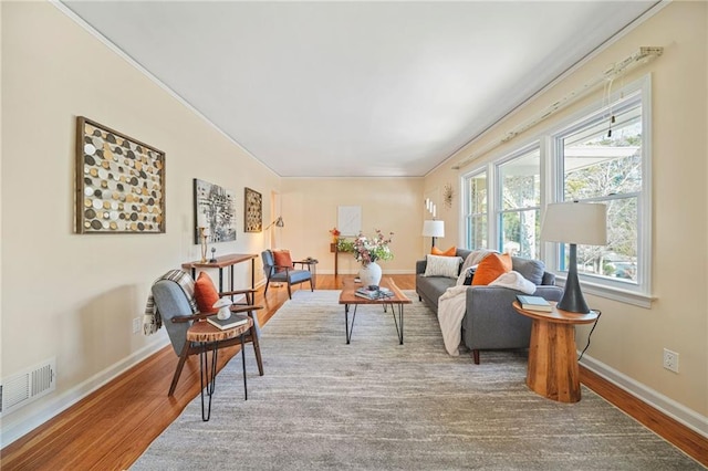 living area with hardwood / wood-style flooring