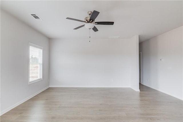 unfurnished room featuring light hardwood / wood-style flooring and ceiling fan