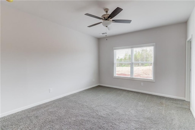 empty room with carpet flooring and ceiling fan