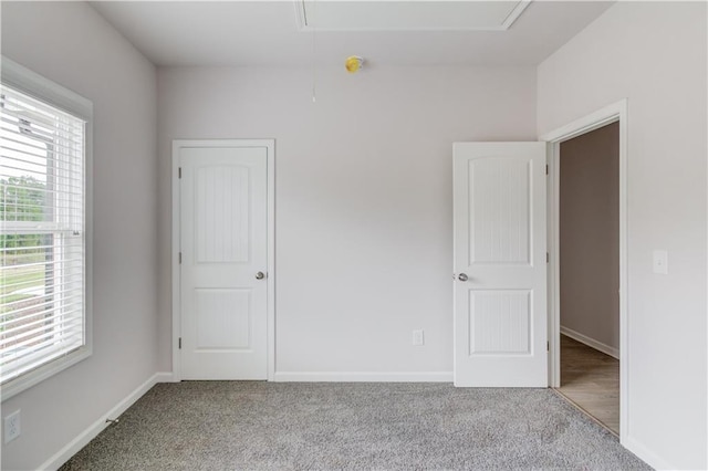 empty room featuring light carpet