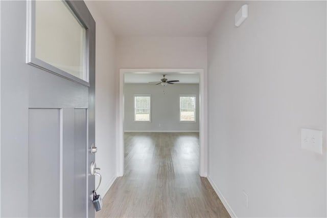 hallway with light wood-type flooring