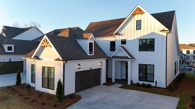 modern inspired farmhouse with a garage