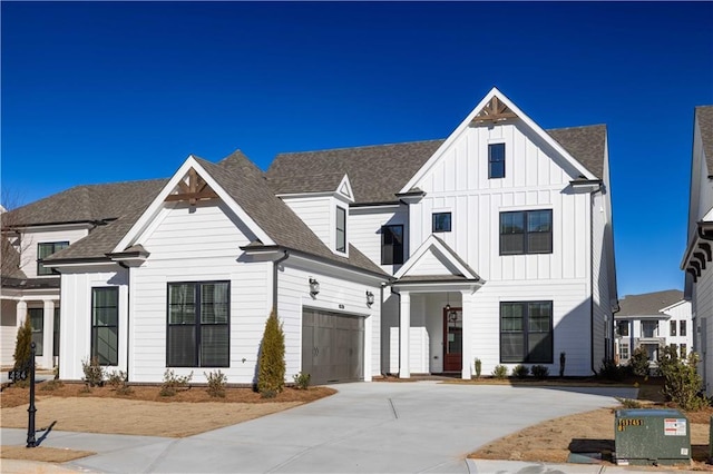 modern inspired farmhouse with a garage