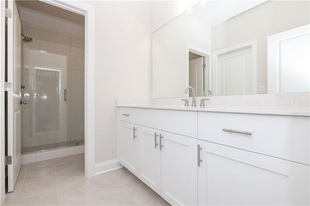 bathroom featuring an enclosed shower, vanity, and tile patterned floors