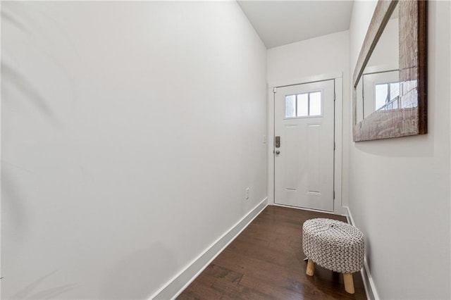 entryway with baseboards and dark wood finished floors