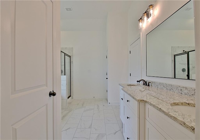 bathroom featuring vanity and an enclosed shower