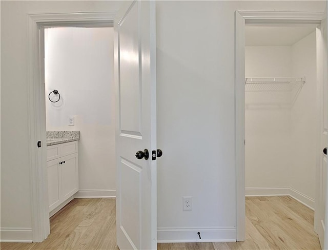 bathroom with hardwood / wood-style floors and vanity