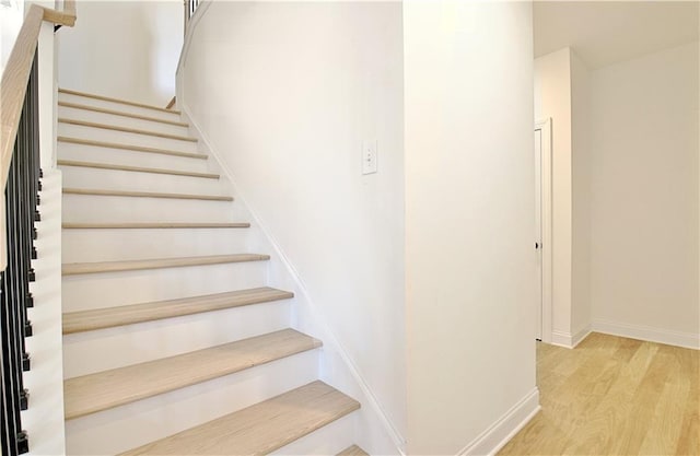 stairway with wood-type flooring