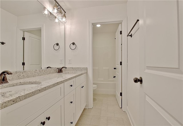 full bathroom featuring tile patterned floors, vanity, toilet, and shower / tub combination