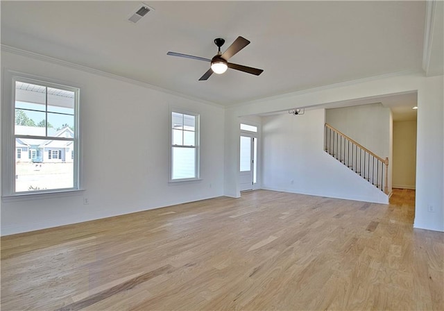 spare room with ceiling fan, light hardwood / wood-style floors, and crown molding