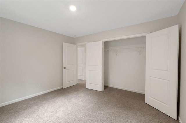 10814 Wheeler Trce, Hampton, GA 30228 - unfurnished bedroom with carpet floors, a closet, and baseboards