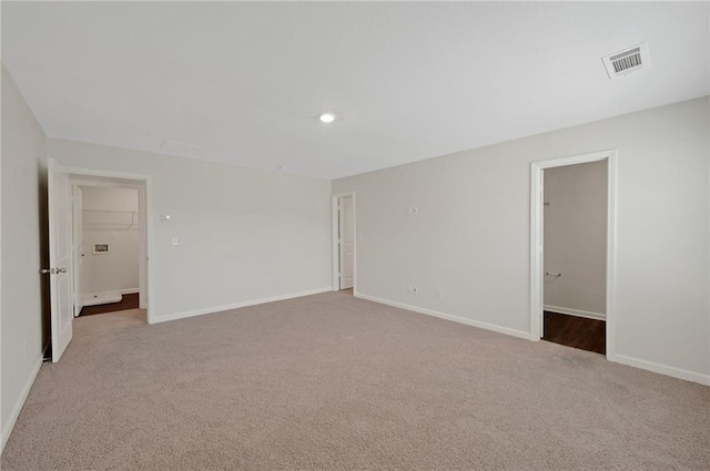10814 Wheeler Trce, Hampton, GA 30228 - spare room featuring carpet, baseboards, and recessed lighting