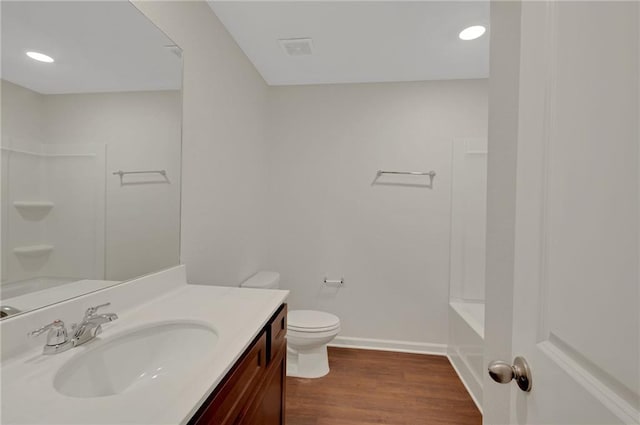 10814 Wheeler Trce, Hampton, GA 30228 - full bathroom featuring vanity, toilet, shower / bath combination, wood finished floors, and baseboards