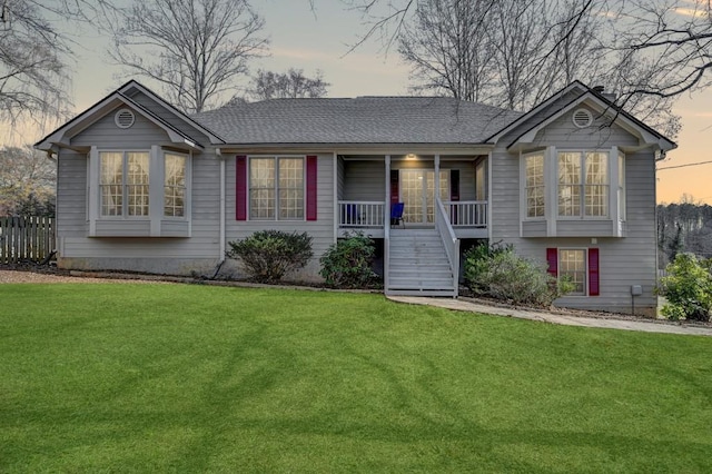 view of front of house featuring a porch and a yard