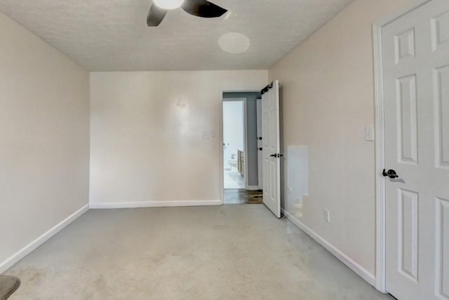 unfurnished room with light colored carpet and ceiling fan